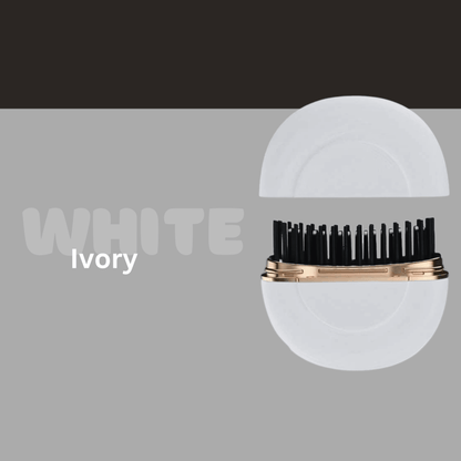 Close-up of the Odyner™ compact hair styler in ivory with black bristles, showcasing innovative design and colors.